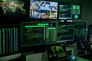 Picture of monitors that are monitoring potential cyber attack threats
